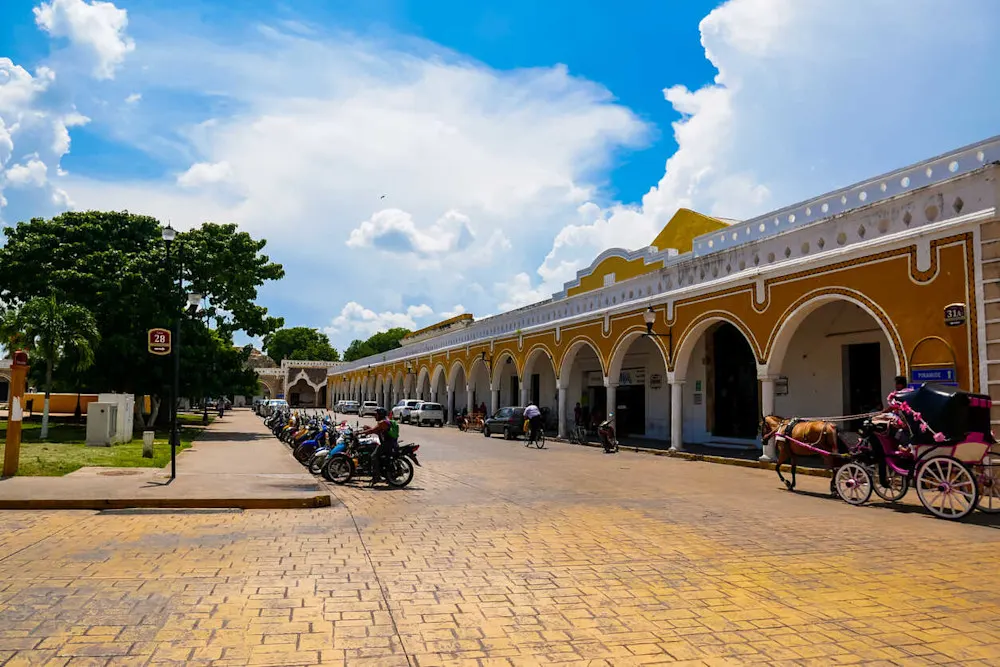 No one knows for sure—but the vibrant yellow paints the town in sunshine year-round.