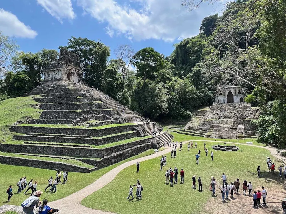 The ancient Mayan ruins of Palenque rise from the lush rainforest.
