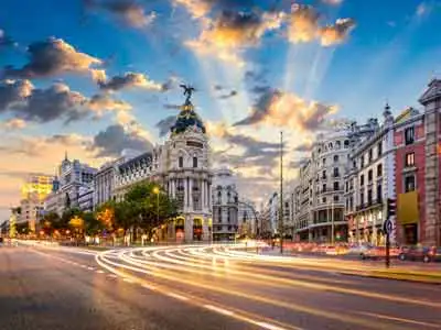 With the right broker, Marsha Scarbrough manages her finances from her home in Madrid, Spain. ©iStock.com/SeanPavone