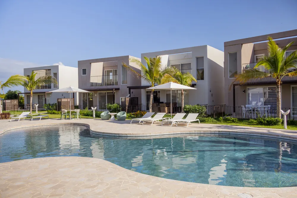 Sweeping ocean views and palm-fringed coastlines define Playa Caracol’s setting.