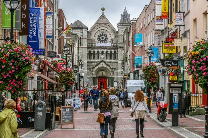 Bustling Grafton Street in Dublin, known for its array of shops and street performers.