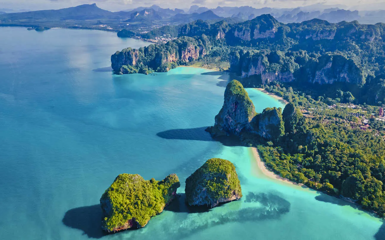 Dramatic limestone cliffs, clear seas, and a slower pace define life along Thailand’s wild western shore.