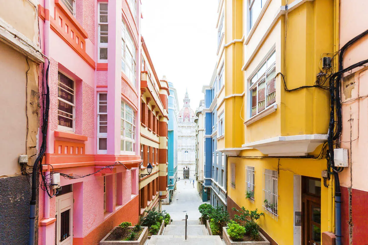 Charming streets of A Coruña, lined with colorful buildings in this coastal Galician city.