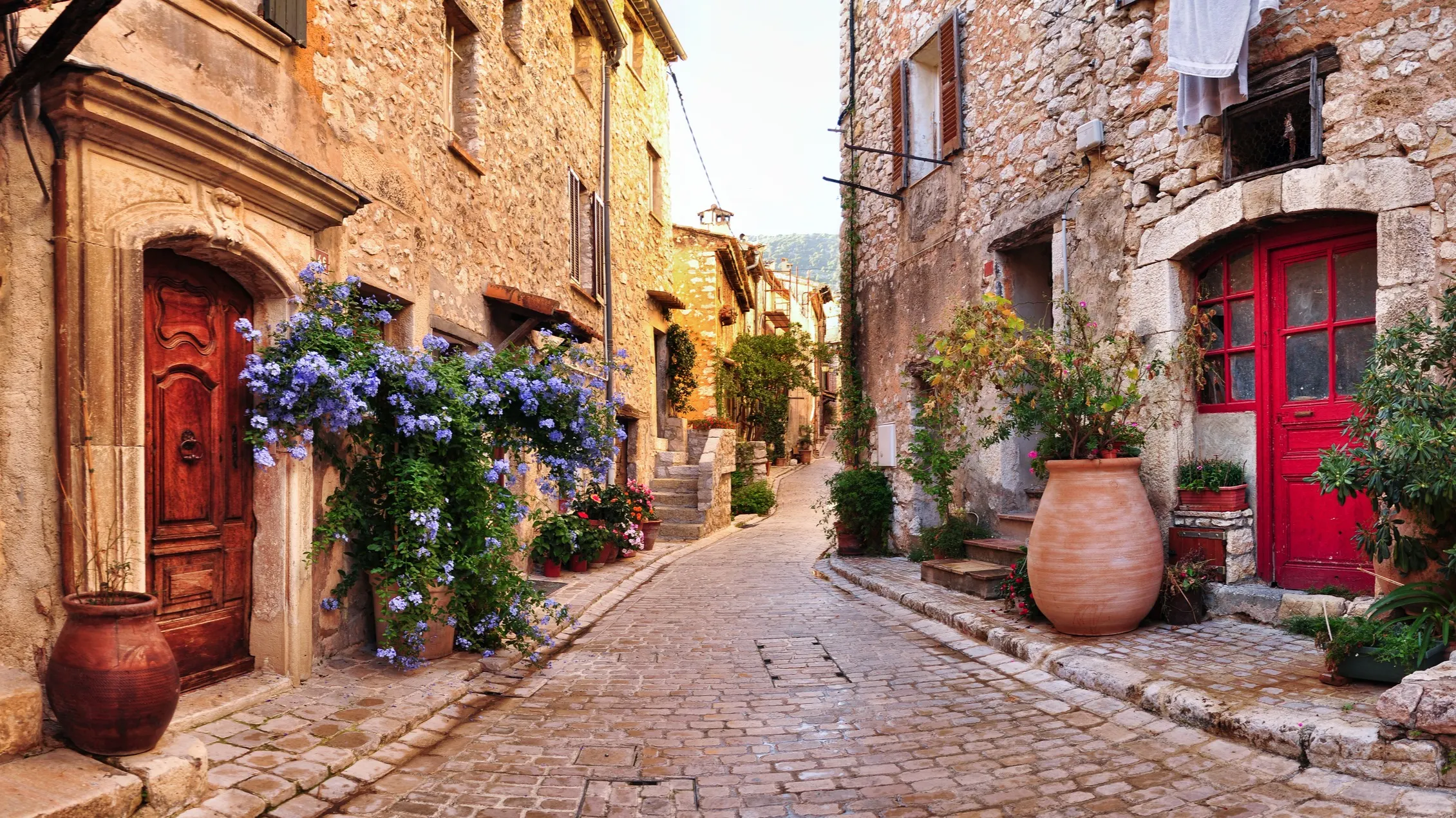 Old French village houses and cobblestone street