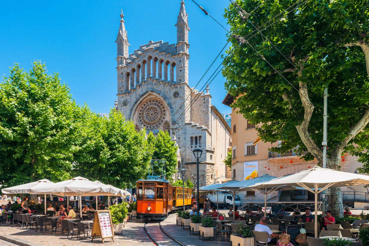 An orange vintage tram—an ode to Sóller’s rich citrus groves—ferries travelers to Old Town.