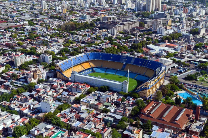 La Boca's colorful buildings and Boca Juniors' iconic stadium. 