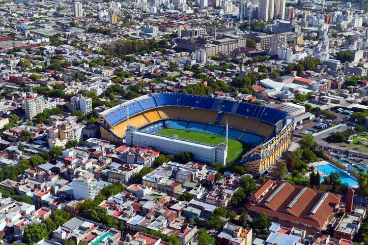 La Boca's colorful buildings and Boca Juniors' iconic stadium.