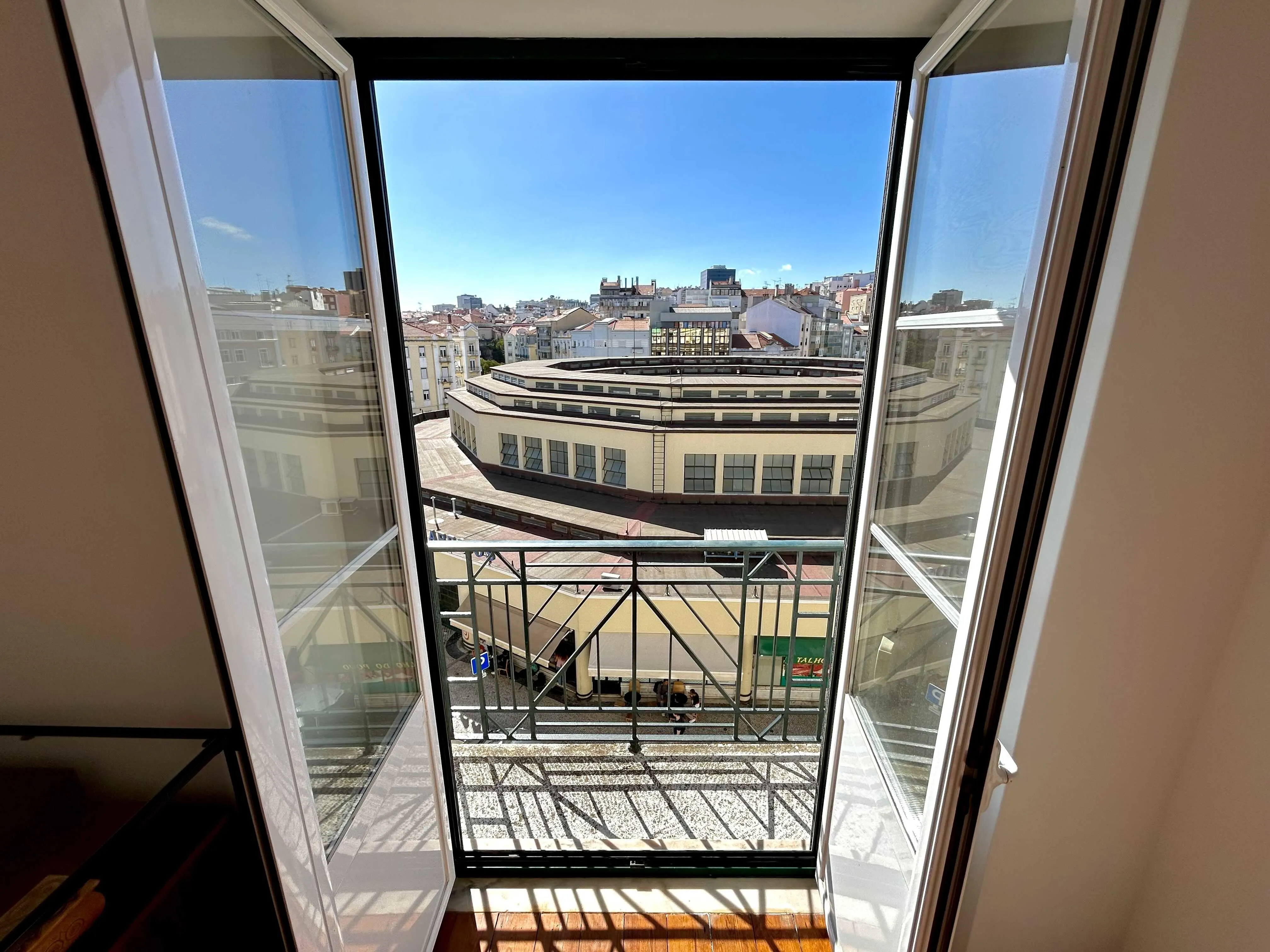 The view from inside our bedroom overlooking the circular Mercado do Arroios (think: daily farmers' market). 