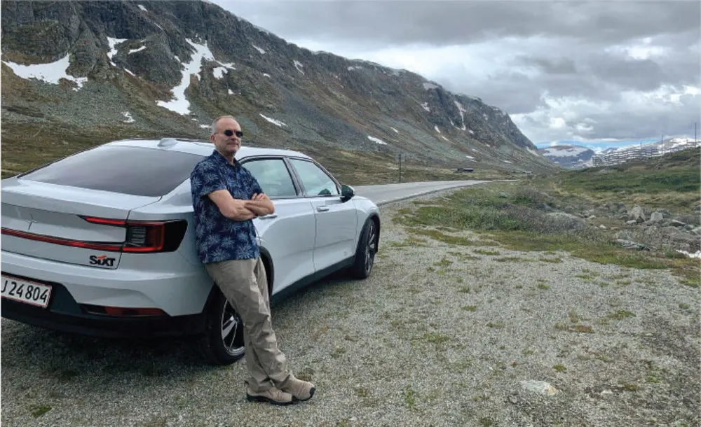 Tim looking cool next to his Polestar 2 in Norway.