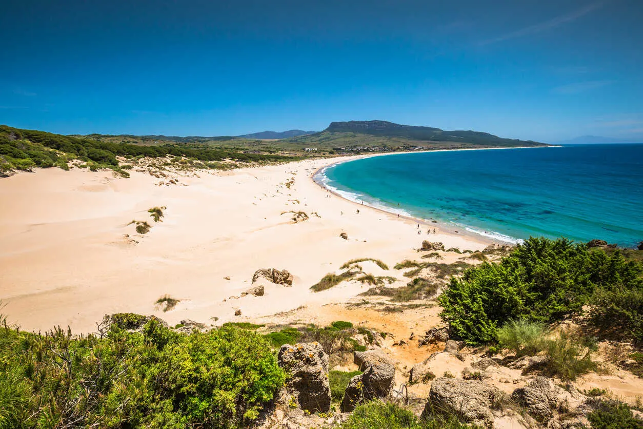 Bolonia Beach’s endless dunes and turquoise water deliver raw, crowd-free Atlantic beauty.