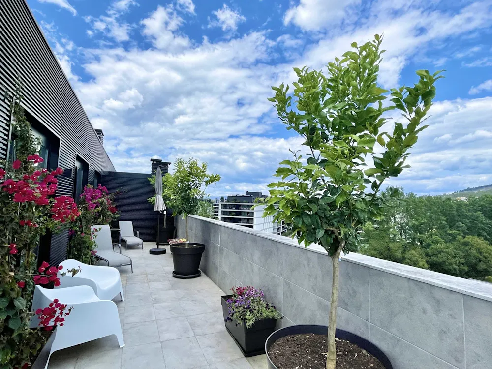 Tim and Irene’s Braga condo offers “acres of terrace” and wide-open views above the city.