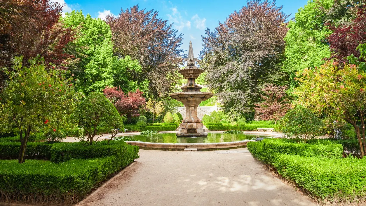 Lush greenery and tranquil paths of the Botanical Garden in Coimbra, Portugal.