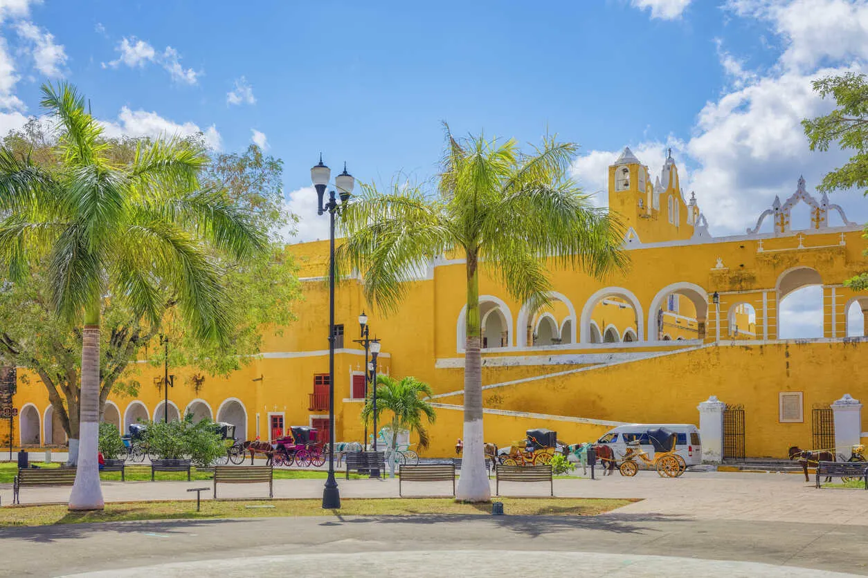 Golden facades glow in Izamal’s sunlit historic center.