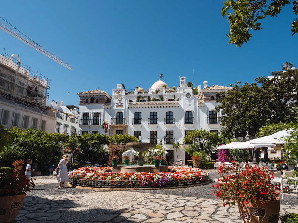 A view of Estepona’s Old Town, filled with colorfully painted flower pots.