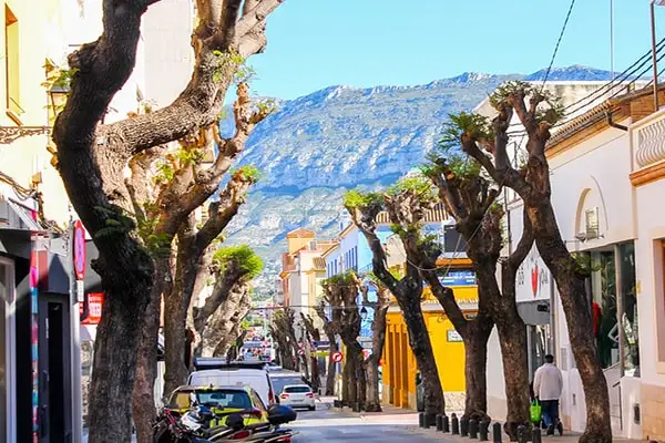 Limestone cliffs back the colorful Spanish town.