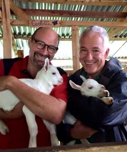 John Michael Arthur (left) and Michael (right) swapped their stressful lives in the U.S. for a calm life in Costa Rica. Now they have time to do things they enjoy—like raising goats.