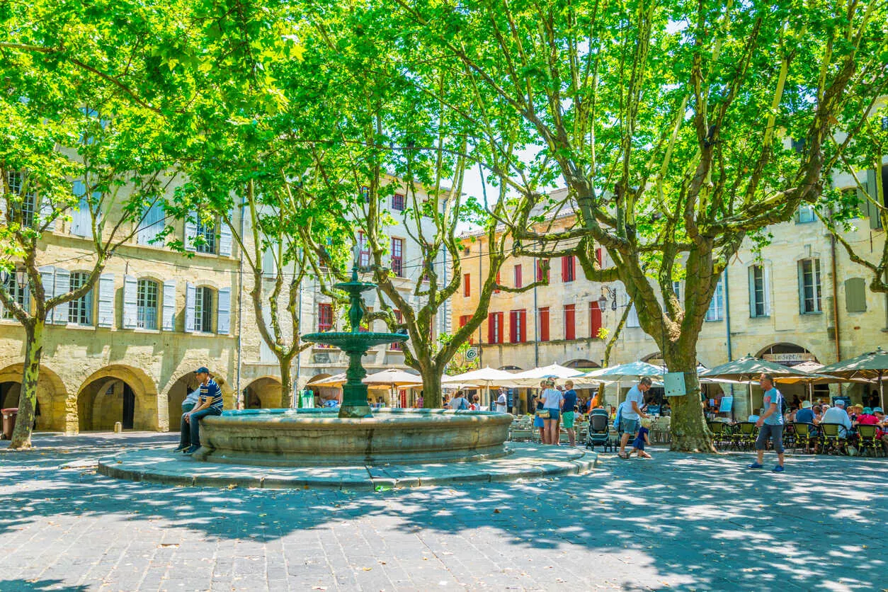 Place aux Herbes has been the social heart of Uzès for centuries, lined with cafés, markets, and honey-colored medieval architecture.