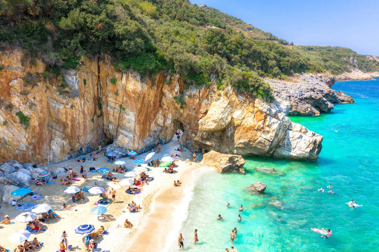 A natural rock arch divides Mylopotamos into two distinct coves.