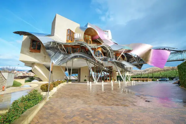 The Hotel Marques de Riscal is a surreal rendering of steel amidst nature, designed by famous architect Frank Gehry. ©iStock./herraez