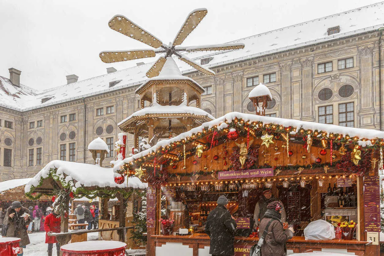 The Residenz courtyard glows with elegant stalls and a classic Christmas vibe.