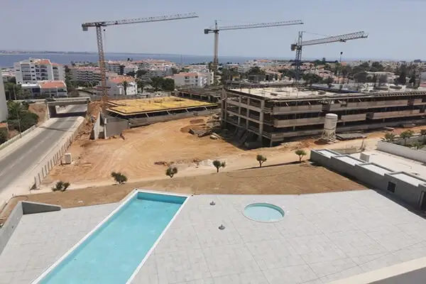 Standing on a balcony of a completed condo in the first phase of Santa Maria taking a picture of Santa Maria III.