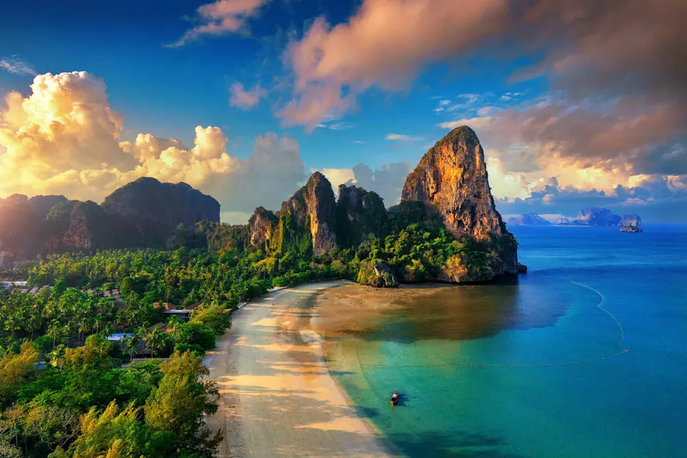 Railay Beach: Turquoise waters, towering cliffs, and serene beauty.