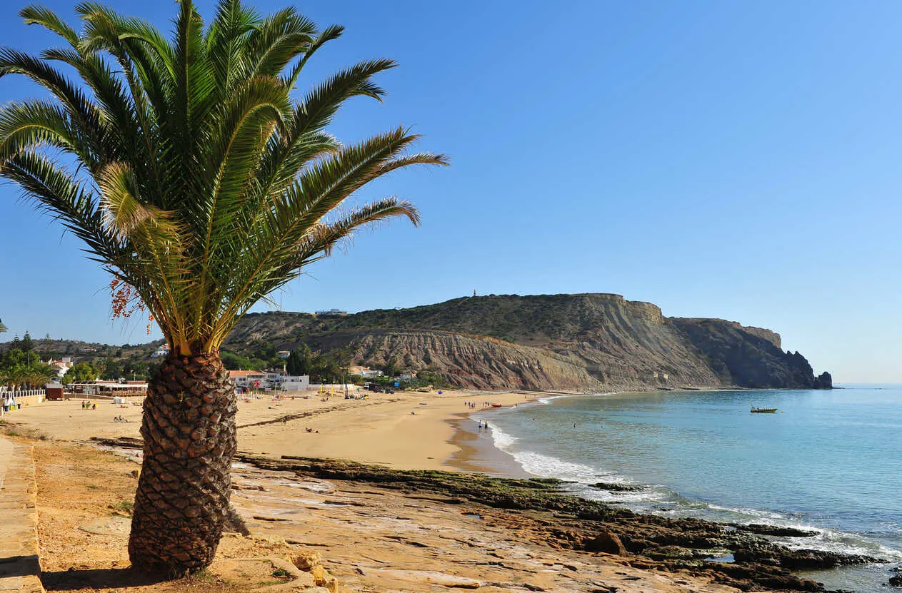 Praia da Luz pairs golden sand with glowing Algarve sunsets.