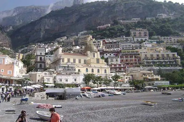 Positano from the beach. In the lower left you can see the drainage conduit used to bring goods and luggage into town. ©JimSantos