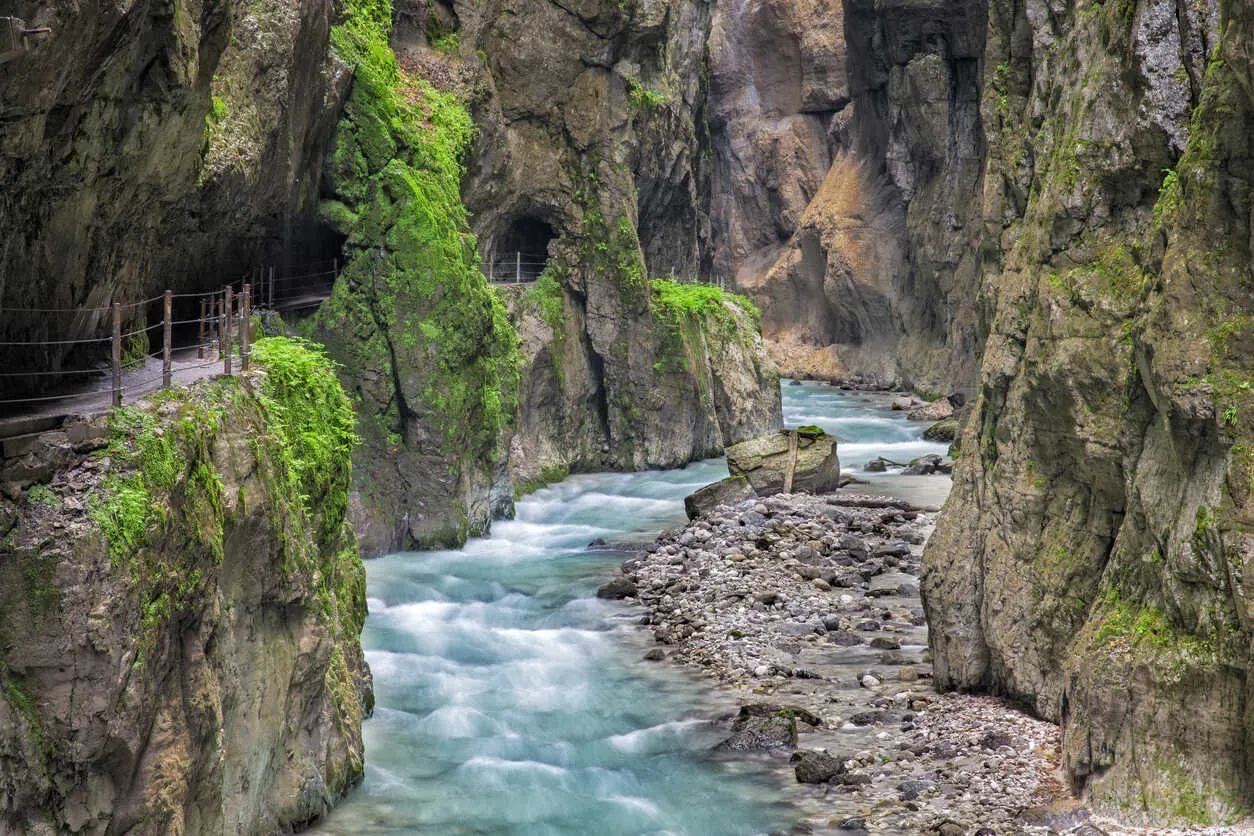 Misty magic at Partnachklamm, where turquoise water cuts through ancient rock.