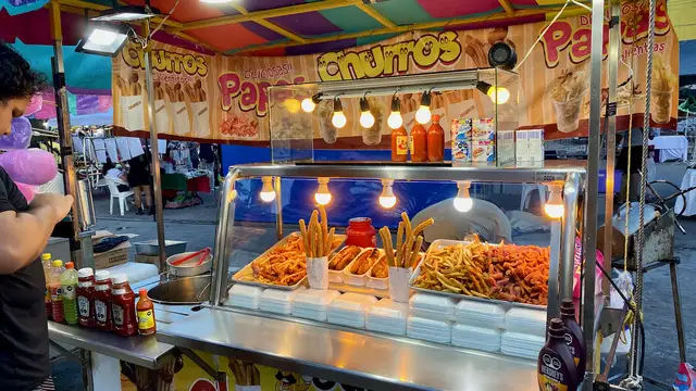 Left to right: deep-fried - hot dog sausages, churros (front), plantain (back), and french fries.