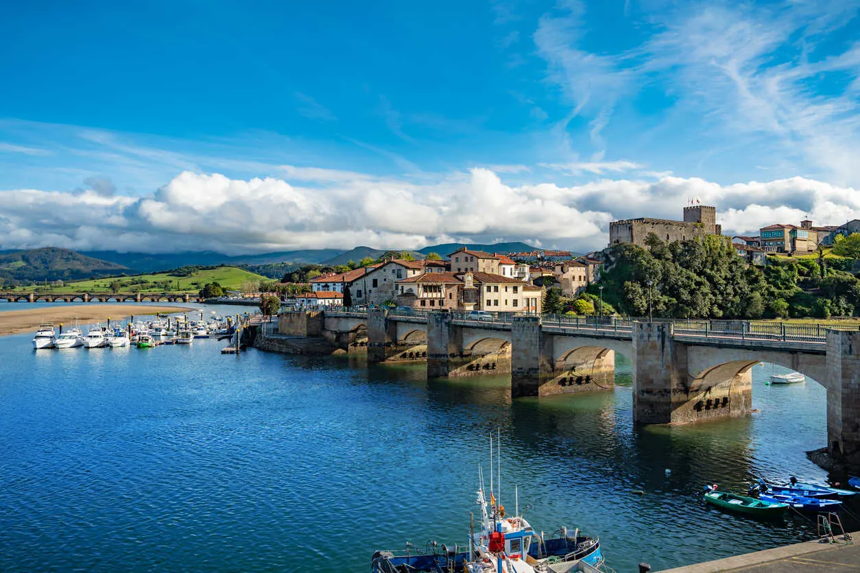 Boats rest quietly in the scenic harbor of San Vicente de la Barquera.