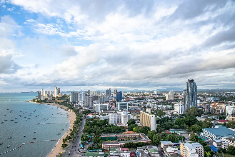 An aerial view of Pattaya showcases the city’s stunning coastline and vibrant skyline.