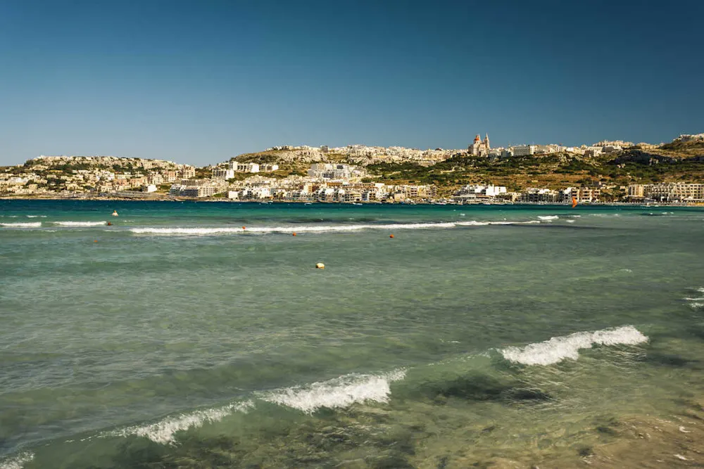 Golden beaches and peaceful hillside views in Malta’s quiet north.