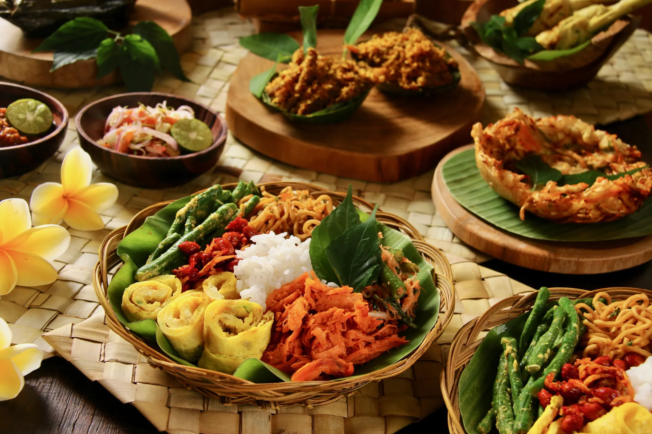 Nasi Campur is a popular Indonesian dish of rice (nasi putih) with a variety of colorful side dishes.