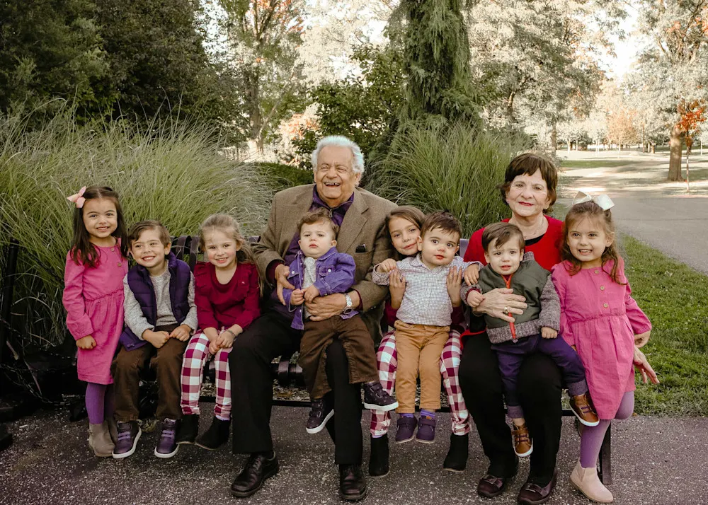 Theresa and her husband surrounded by their greatest joy—their beloved grandchildren.