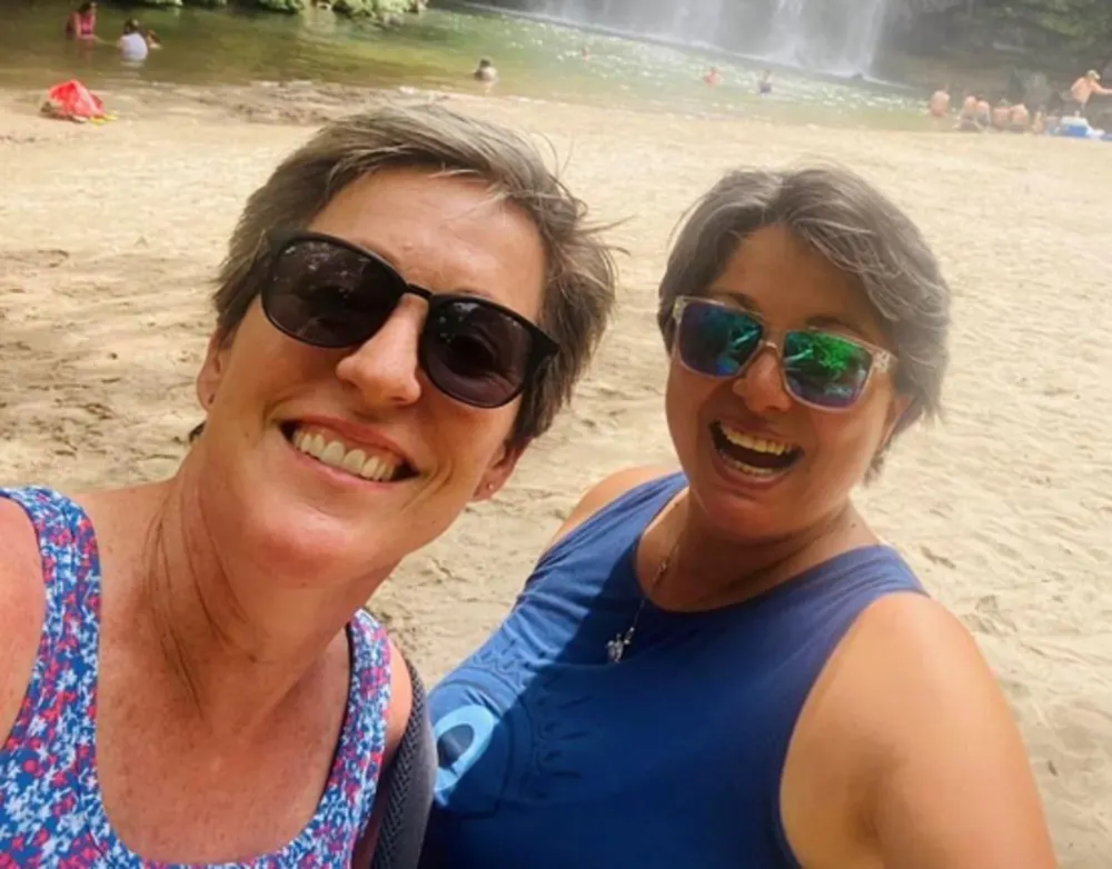 Vanessa (left) and Luisa (right) enjoy the weather, nature, and cost of living around Lake Arenal.