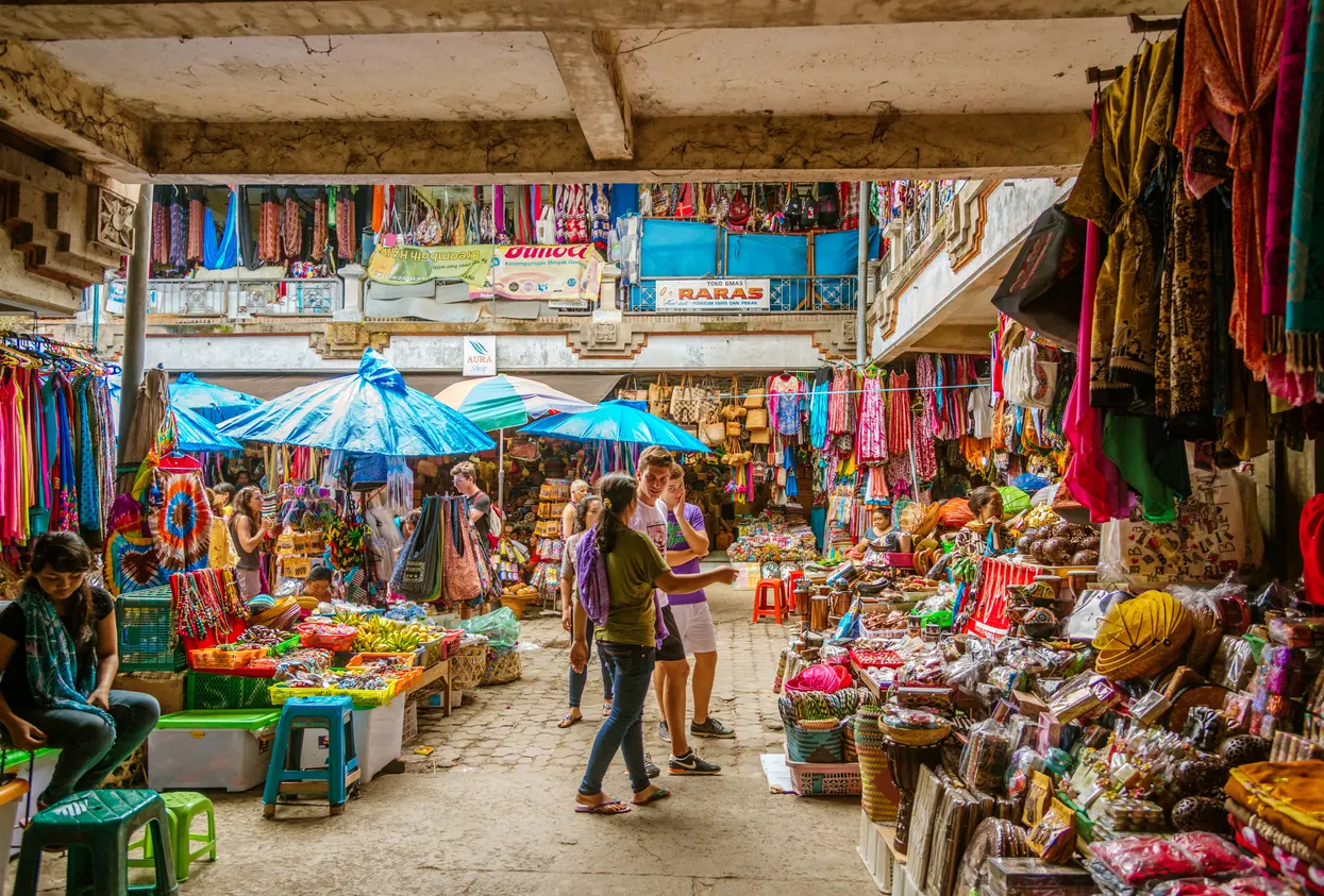 Beth buys art supplies in Ubud, then sells her paintings at the market—making up to $1,200 a month.