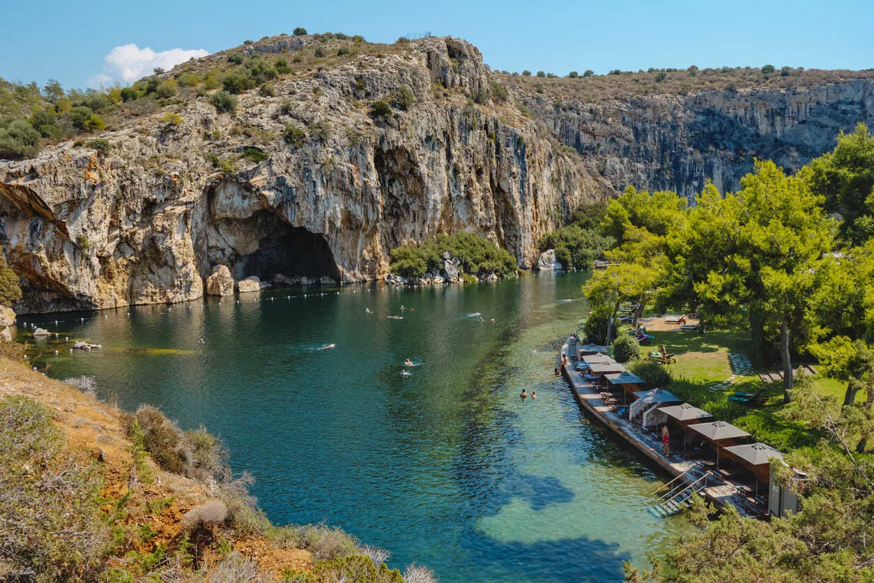 Relax in warm waters with a stunning cliffside view.