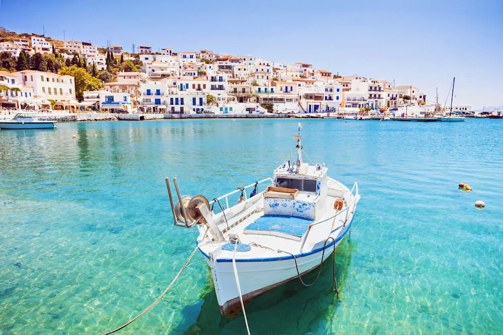 Harbor scenes in Andros, where Cycladic charm meets crystal-clear waters
