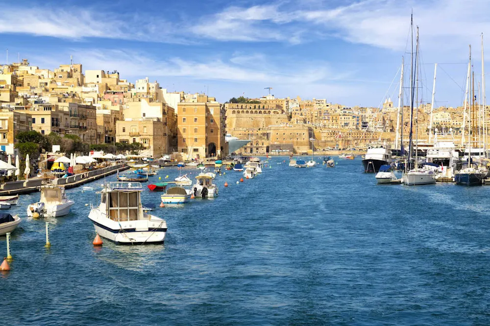 Bustling Valletta Harbor captures Malta’s vibrant, urban spirit.