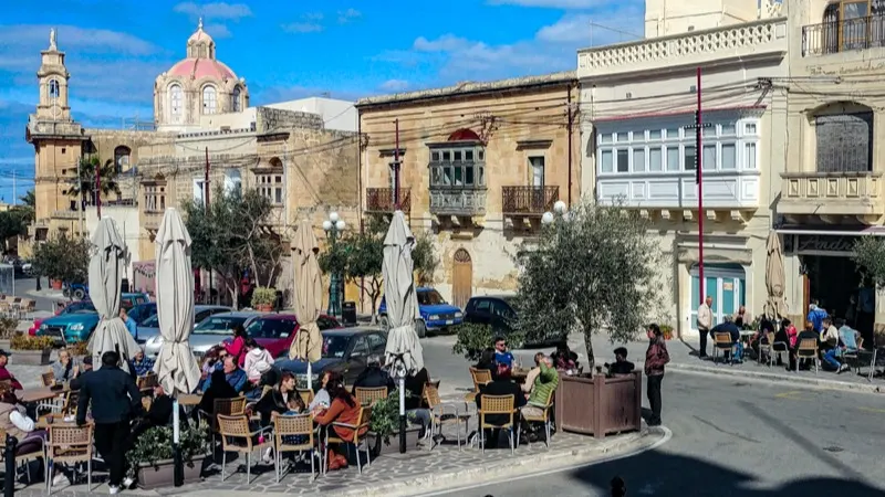 Afternoon coffee with friends and neighbors in the village square.