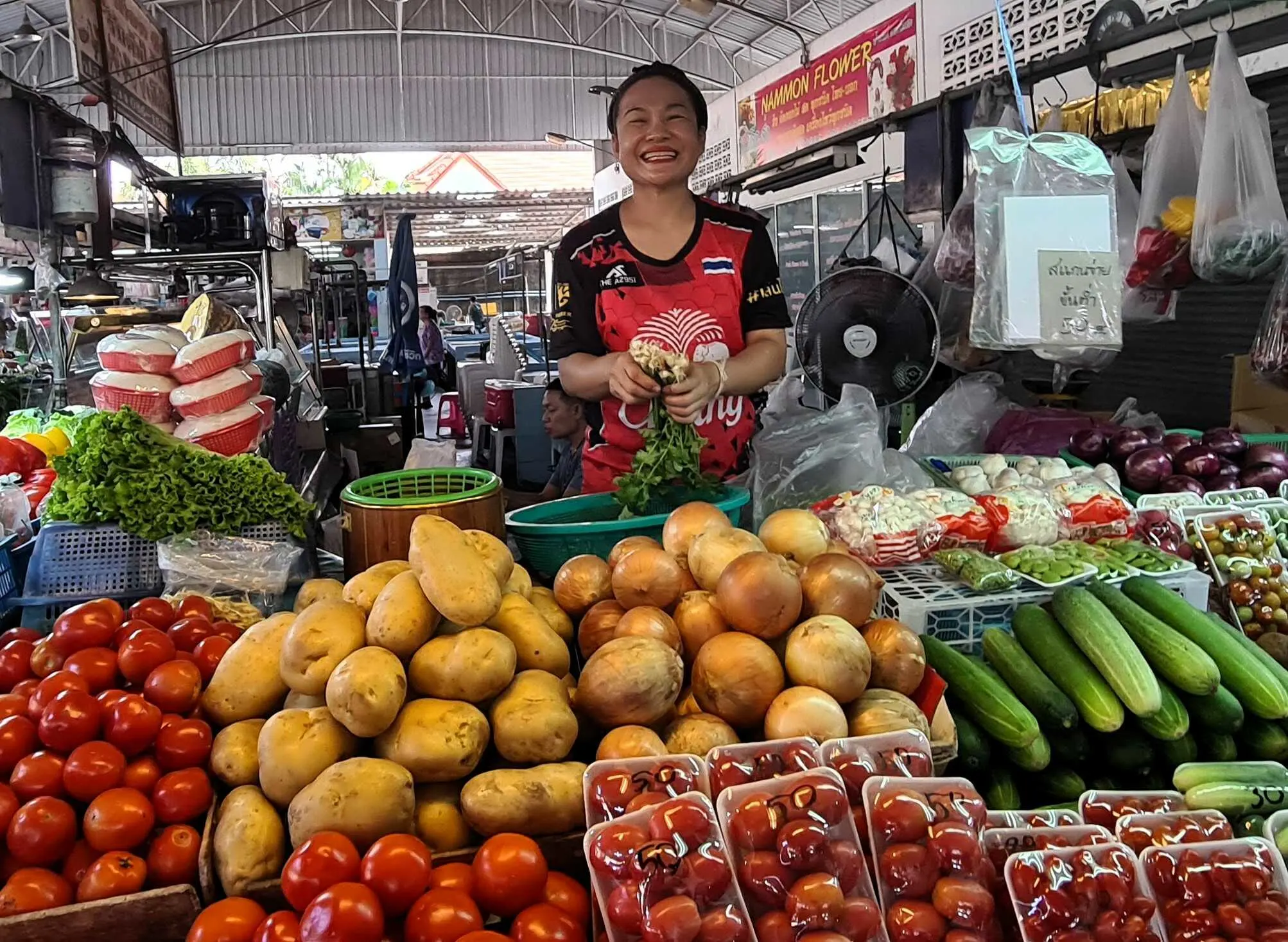 Wan, the friendly vegetable vendor with the best smile,