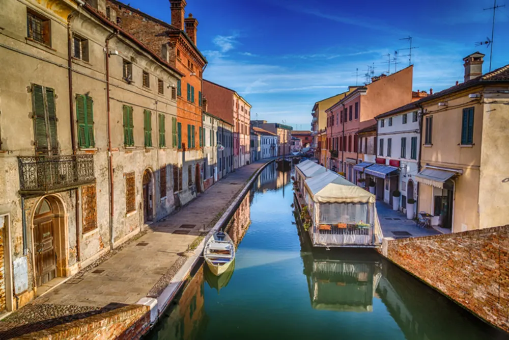 Discover the charming canals and picturesque bridges of Comacchio.