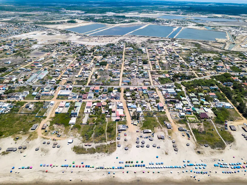Fishing boats and families line the shores of Playas.