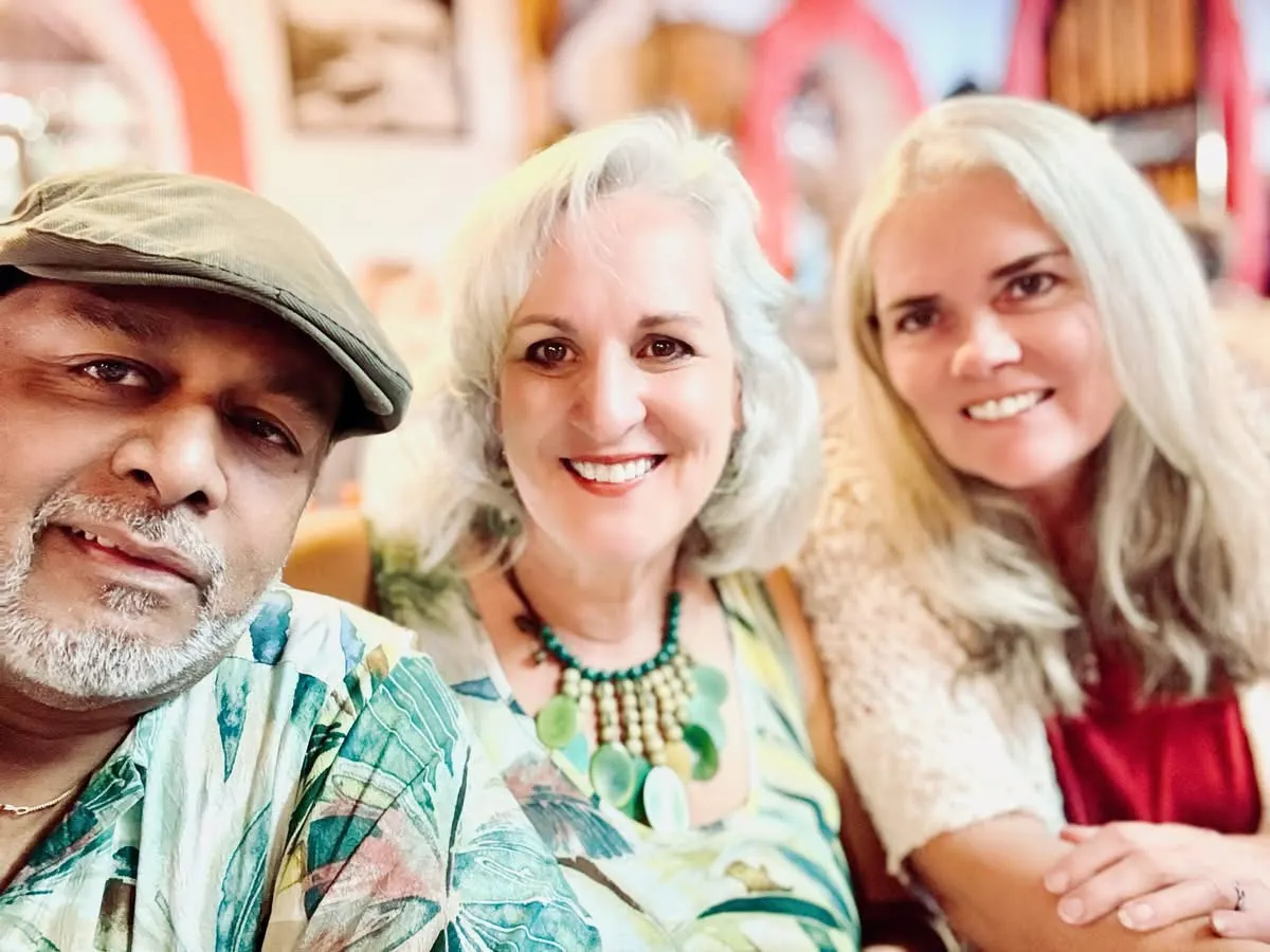 Vijay, Mona and Leena sharing laughs abroad—a reminder that home is where you feel most alive.