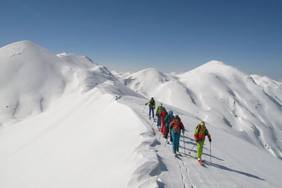 People ski touring on the mountains in Crete