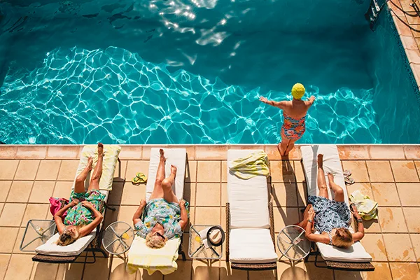 Seniors laying by the pool