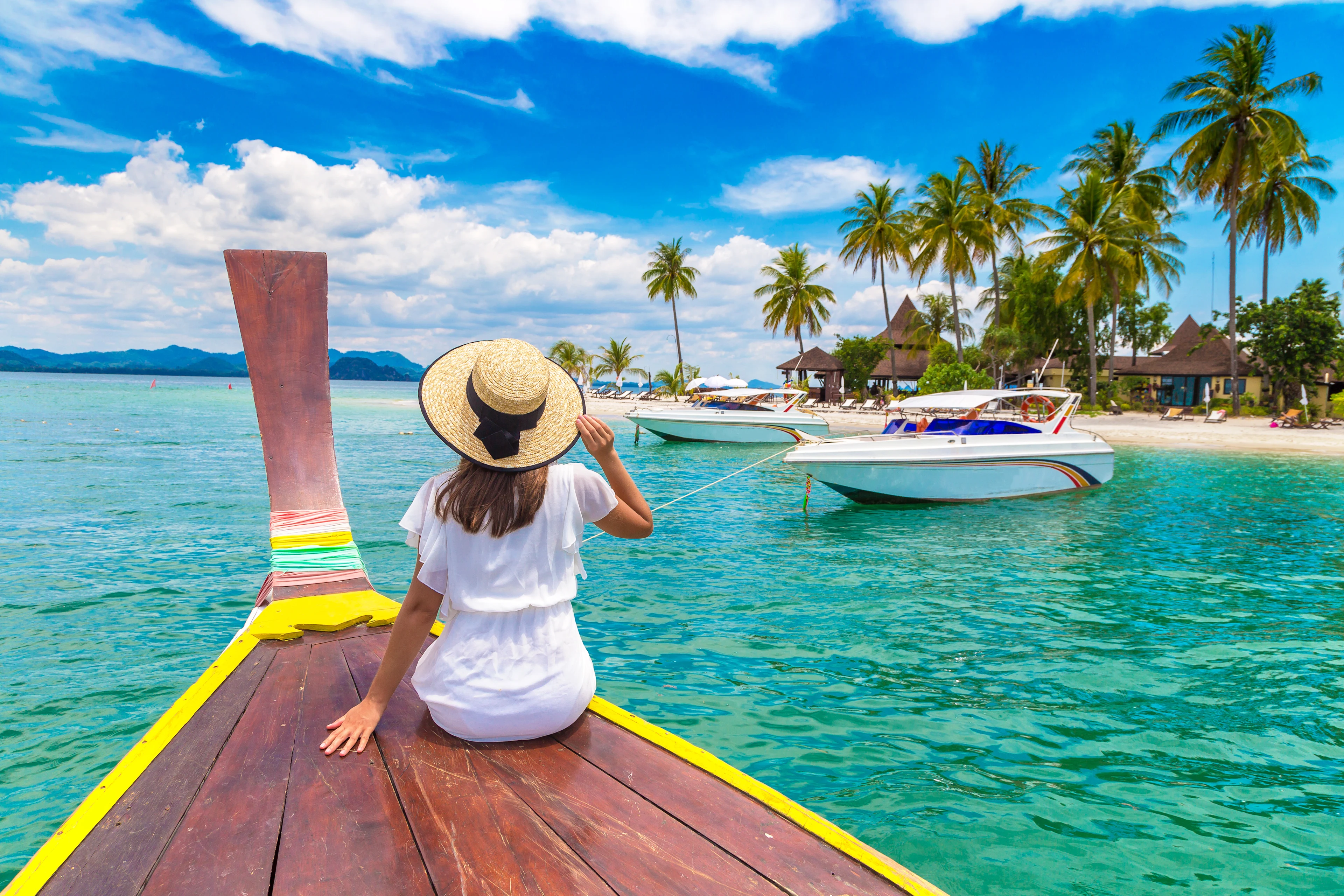 Kvinna på en båt i Thailand