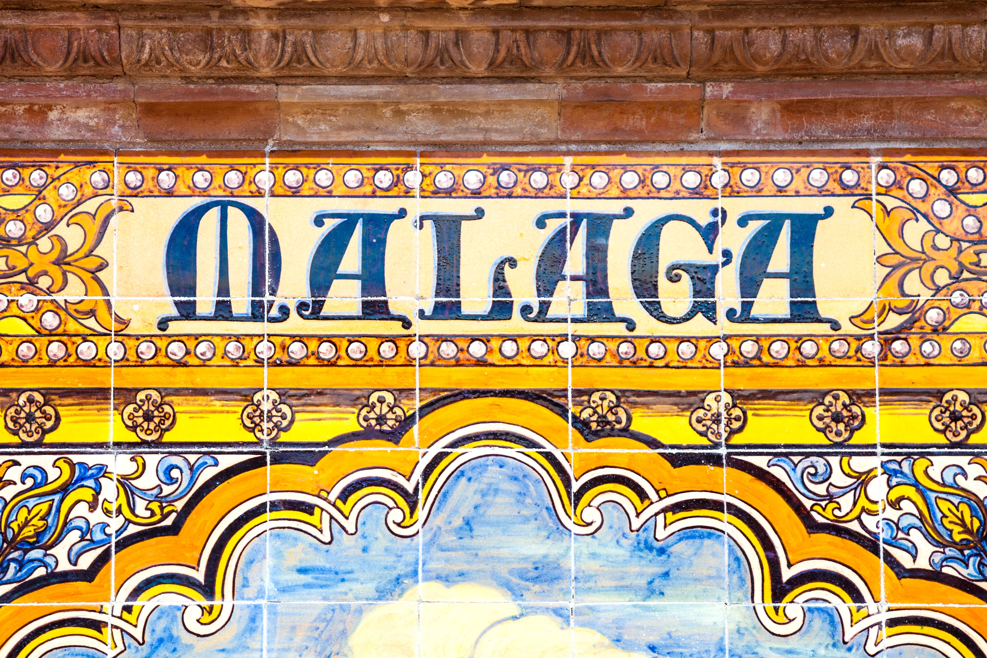 Kakelvägg med texten Malaga