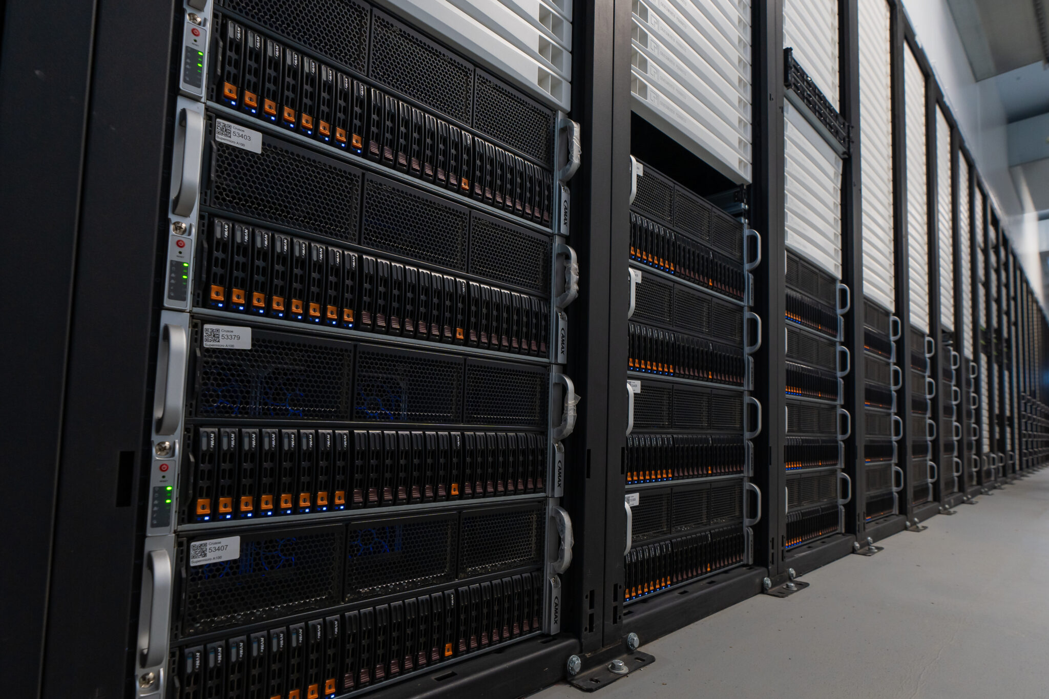 Servers inside a Crusoe Energy data center. The company operates data centers that power energy-greedy sectors like bitcoin mining and AI with excess and ultra-cheap renewables or on natural gas that would otherwise be flared into the atmosphere, as shown here. Photo credit: Crusoe Energy.